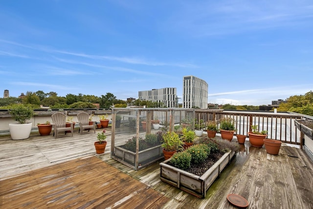5486 S Woodlawn Ave Unit 3, Chicago, IL 60615 - wooden terrace featuring a view of city