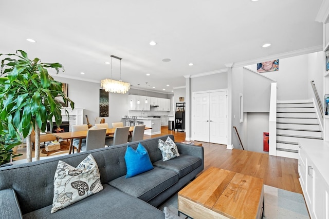 5486 S Woodlawn Ave Unit 3, Chicago, IL 60615 - living room featuring recessed lighting, ornamental molding, stairway, and light wood-type flooring