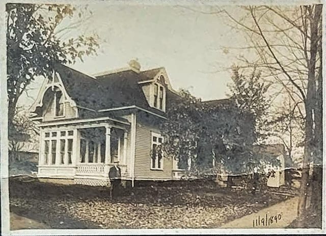 view of property exterior featuring a sunroom