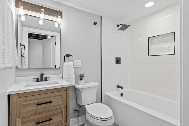 bathroom featuring toilet, vanity, and shower / bathing tub combination