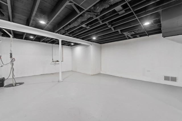 finished basement featuring visible vents