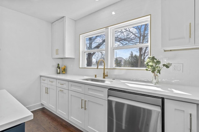 bar with stainless steel dishwasher, tasteful backsplash, dark wood-type flooring, and a sink