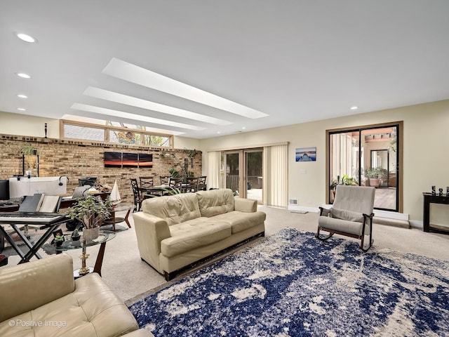 carpeted living area featuring baseboards and recessed lighting