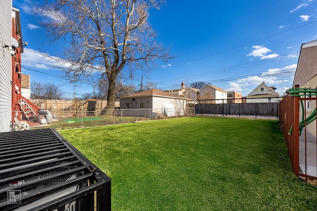 view of yard with a fenced backyard