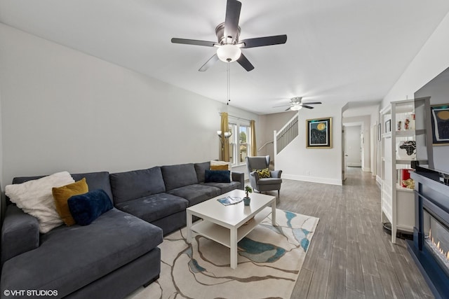 6317 W Roscoe St, Chicago, IL 60634 - living room with a ceiling fan, stairs, and wood finished floors