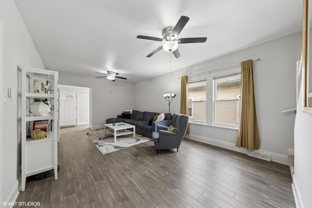 6317 W Roscoe St, Chicago, IL 60634 - living area featuring a ceiling fan and dark wood-type flooring