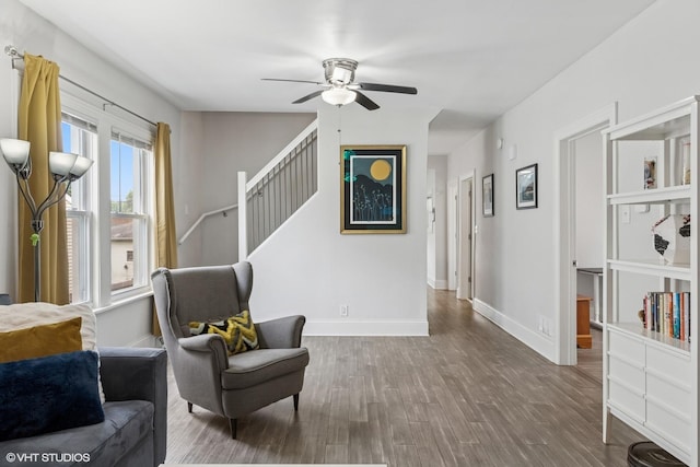 6317 W Roscoe St, Chicago, IL 60634 - living area featuring ceiling fan, wood finished floors, and stairway