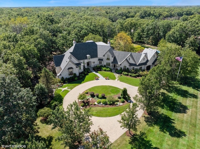 aerial view featuring a wooded view