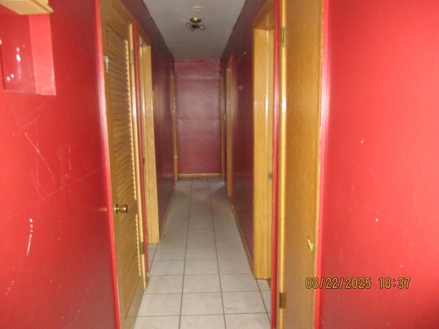 corridor with light tile patterned floors