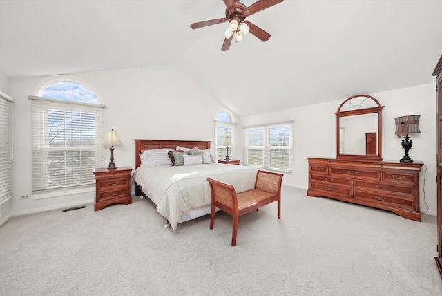 carpeted bedroom featuring baseboards, visible vents, ceiling fan, and lofted ceiling