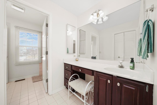 bathroom with tile patterned floors, visible vents, baseboards, and vanity