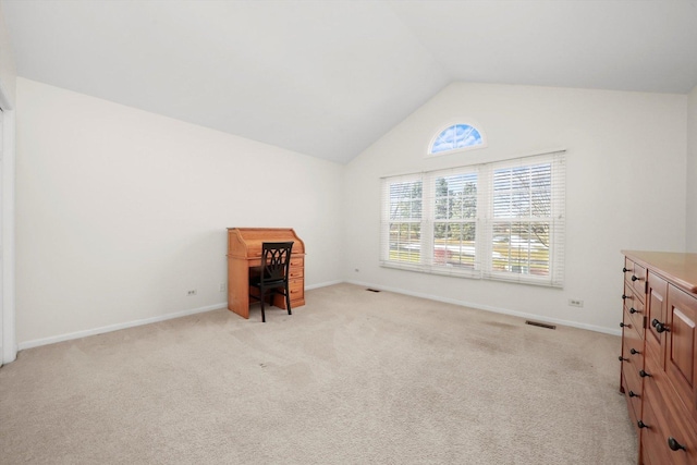 unfurnished bedroom featuring light carpet, baseboards, visible vents, and lofted ceiling