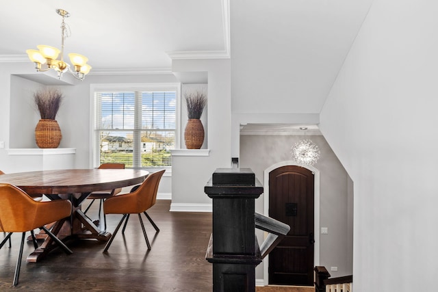104 W Kennedy Ln, Hinsdale, IL 60521 - dining area featuring a chandelier, dark wood finished floors, arched walkways, ornamental molding, and baseboards