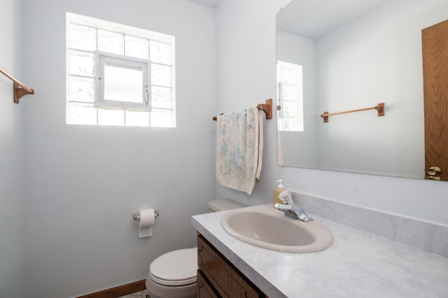 bathroom with toilet and vanity