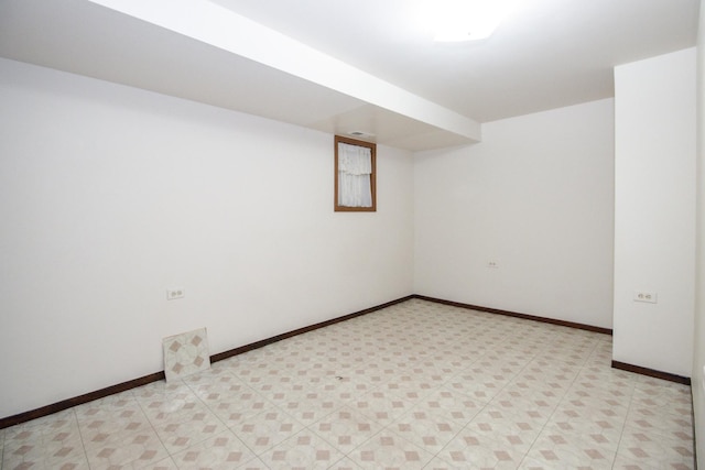 finished basement featuring baseboards