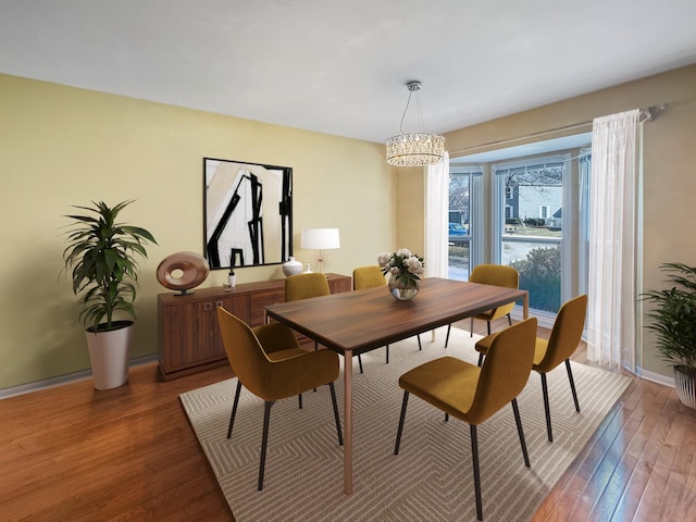 232 Southfield Dr, Vernon Hills, IL 60061 - dining space with a chandelier, wood-type flooring, and baseboards