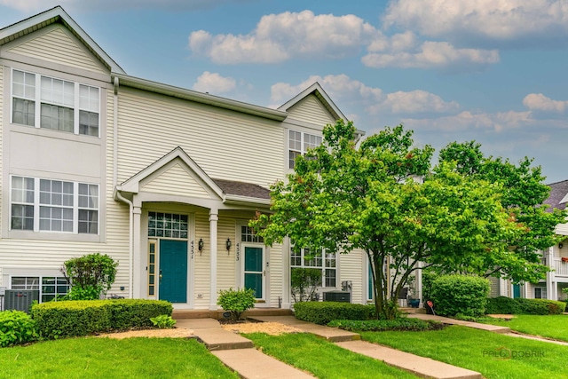 4553 W Hill Ave Unit 3, Waukegan, IL 60085 - view of property featuring a front yard and central AC