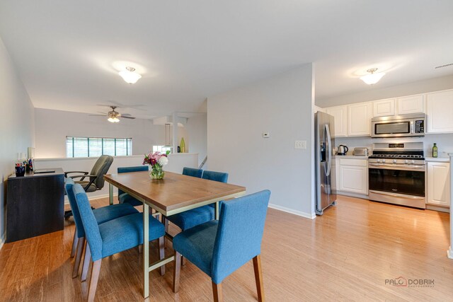 4553 W Hill Ave Unit 3, Waukegan, IL 60085 - dining space featuring light wood-style floors, ceiling fan, and baseboards
