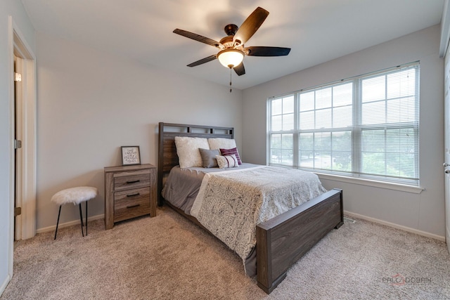4553 W Hill Ave Unit 3, Waukegan, IL 60085 - bedroom featuring multiple windows, baseboards, light colored carpet, and ceiling fan
