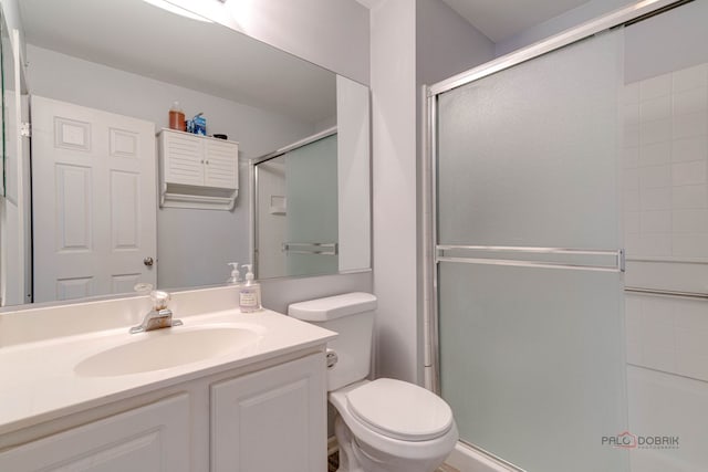 4553 W Hill Ave Unit 3, Waukegan, IL 60085 - bathroom with an enclosed shower, toilet, and vanity