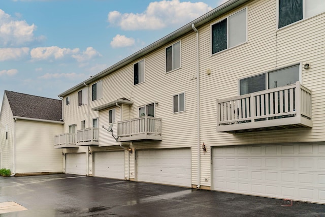 4553 W Hill Ave Unit 3, Waukegan, IL 60085 - view of building exterior featuring a garage and driveway