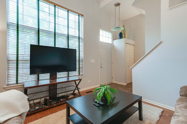 4553 W Hill Ave Unit 3, Waukegan, IL 60085 - living room with wood finished floors, baseboards, an office area, and high vaulted ceiling