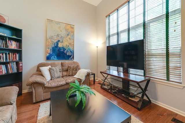 4553 W Hill Ave Unit 3, Waukegan, IL 60085 - living room featuring baseboards and wood finished floors