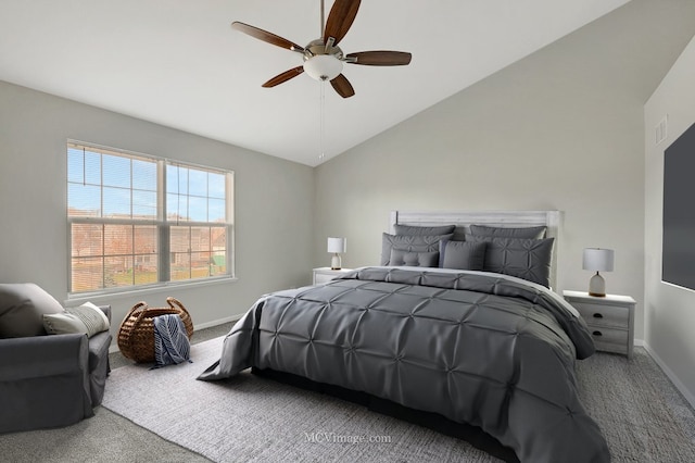 bedroom featuring carpet flooring, lofted ceiling, baseboards, and a ceiling fan