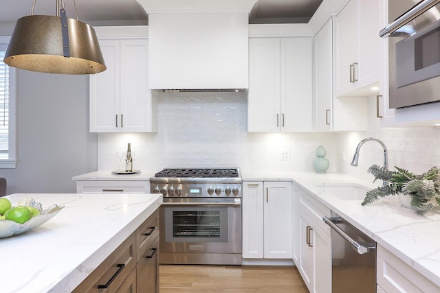 514 Hillgrove Ave Unit 204, Western Springs, IL 60558 - kitchen with white cabinetry, a sink, stainless steel appliances, and pendant lighting