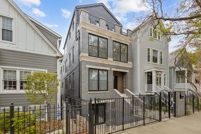 1522 W Wolfram St, Chicago, IL 60657 - view of front of property with brick siding, a gate, and a fenced front yard