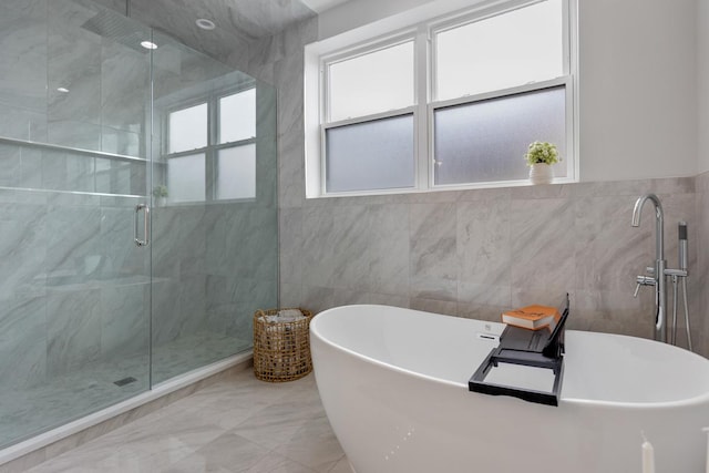 1522 W Wolfram St, Chicago, IL 60657 - bathroom featuring a healthy amount of sunlight, tile walls, a stall shower, and a freestanding tub