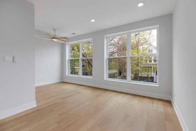 1522 W Wolfram St, Chicago, IL 60657 - spare room with light wood-style floors, baseboards, ceiling fan, and a wealth of natural light