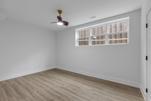 1522 W Wolfram St, Chicago, IL 60657 - empty room with baseboards, visible vents, plenty of natural light, and light wood finished floors