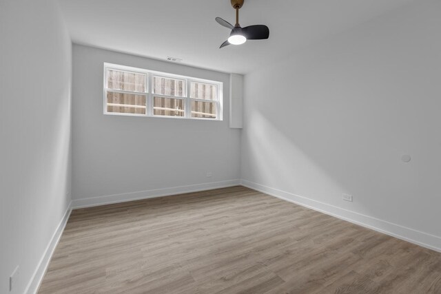1522 W Wolfram St, Chicago, IL 60657 - unfurnished room featuring baseboards, ceiling fan, wood finished floors, and visible vents