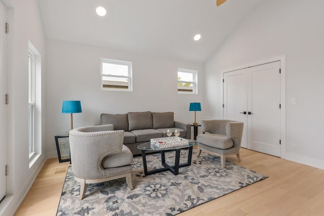 1522 W Wolfram St, Chicago, IL 60657 - living room featuring light wood-type flooring, recessed lighting, baseboards, and lofted ceiling