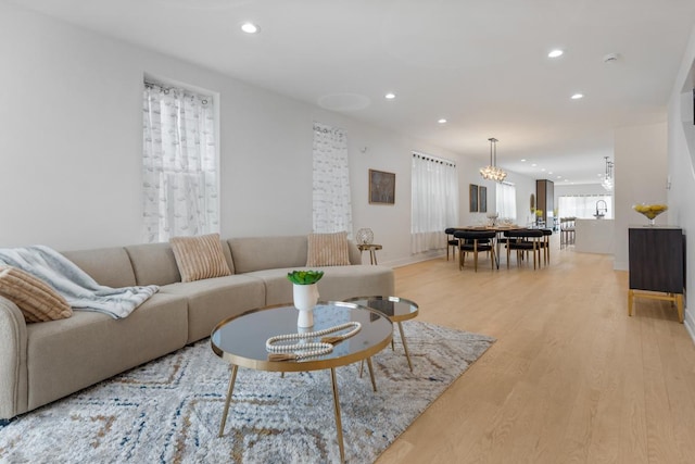 1522 W Wolfram St, Chicago, IL 60657 - living area with recessed lighting, an inviting chandelier, and light wood-type flooring
