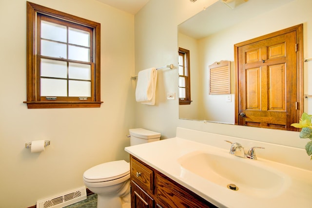 809 S Charles Ave, Naperville, IL 60540 - half bathroom featuring vanity, toilet, and visible vents