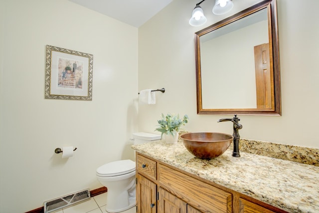 809 S Charles Ave, Naperville, IL 60540 - half bath with tile patterned floors, vanity, toilet, and visible vents