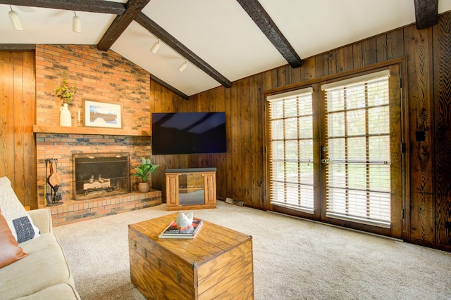 809 S Charles Ave, Naperville, IL 60540 - living room featuring vaulted ceiling with beams, carpet flooring, a brick fireplace, and wood walls