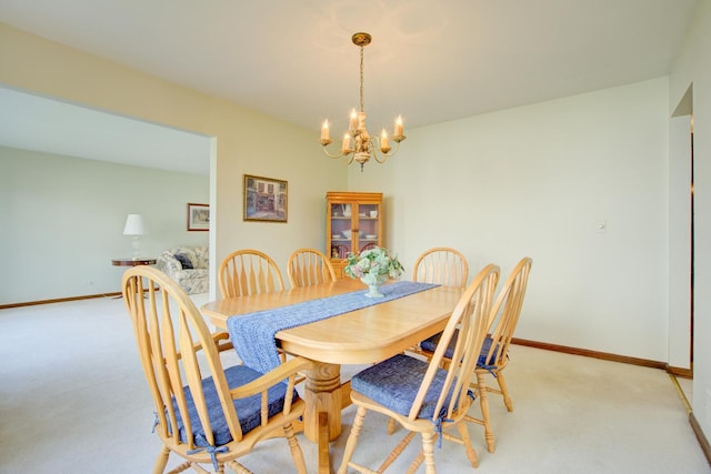 809 S Charles Ave, Naperville, IL 60540 - dining area featuring light colored carpet, baseboards, and a chandelier