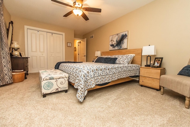 bedroom featuring a closet, carpet flooring, ceiling fan, and visible vents