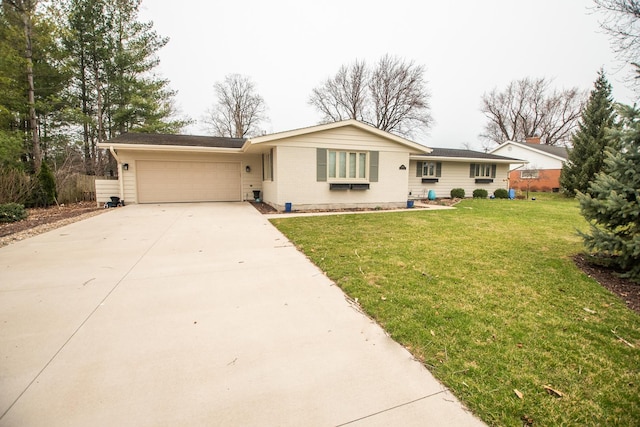 single story home with brick siding, a garage, a front lawn, and concrete driveway