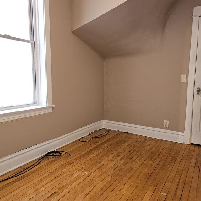 2251 S Kirkland Ave, Chicago, IL 60623 - bonus room featuring baseboards and hardwood / wood-style flooring