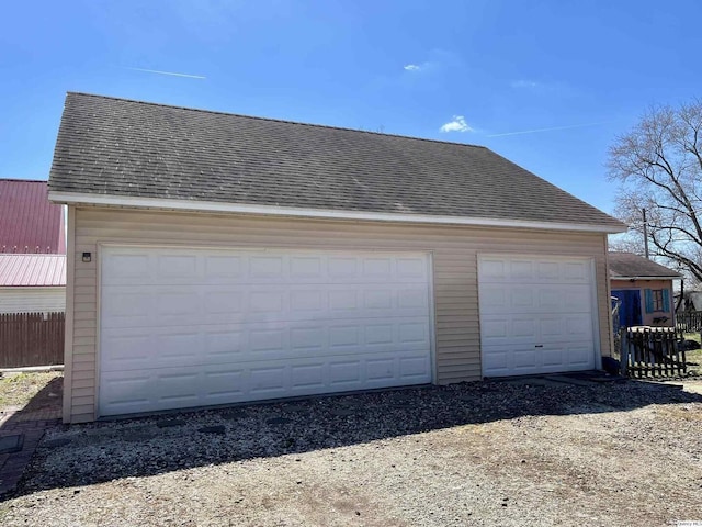 detached garage with fence