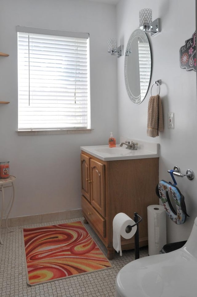 bathroom with tile patterned floors and vanity