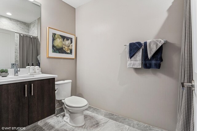 1841 N California Ave Unit 3A, Chicago, IL 60647 - bathroom with toilet, vanity, marble finish flooring, and a shower with shower curtain
