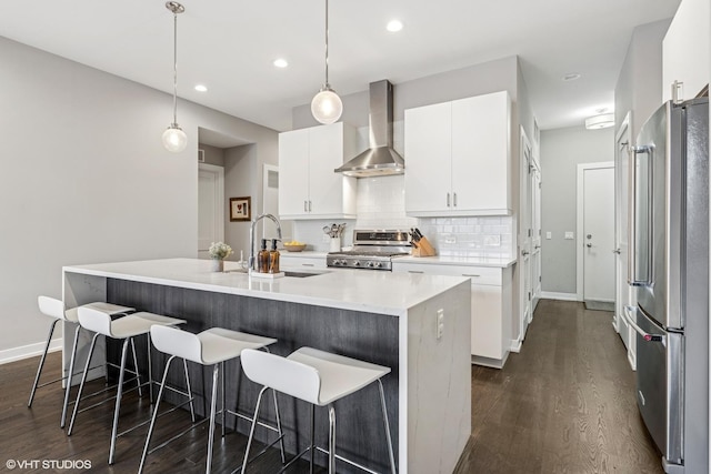 1841 N California Ave Unit 3A, Chicago, IL 60647 - kitchen featuring freestanding refrigerator, wall chimney exhaust hood, range, a sink, and dark wood-type flooring