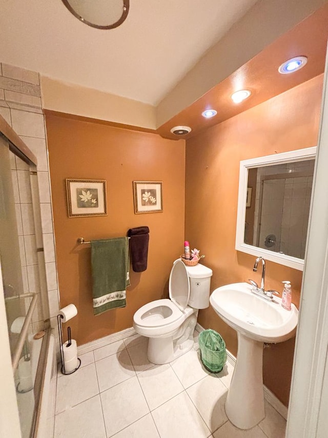5500 Lincoln Ave Ave Unit 118E, Morton Grove, IL 60053 - full bathroom featuring a shower with shower door, tile patterned flooring, and recessed lighting