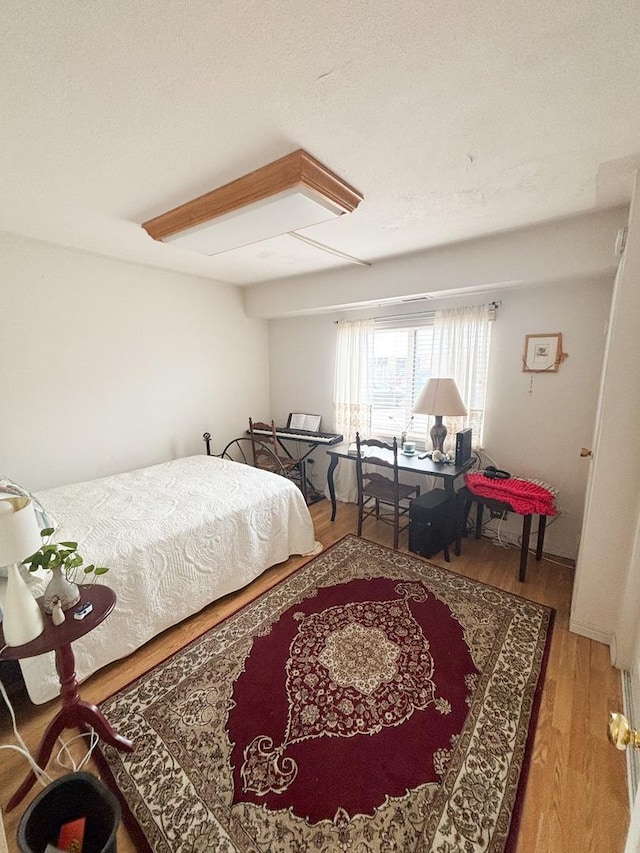 5500 Lincoln Ave Ave Unit 118E, Morton Grove, IL 60053 - bedroom with wood finished floors