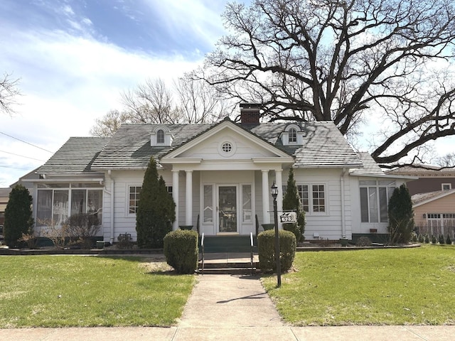 529 Pearl St, Ottawa, IL 61350 - neoclassical home with a chimney and a front yard